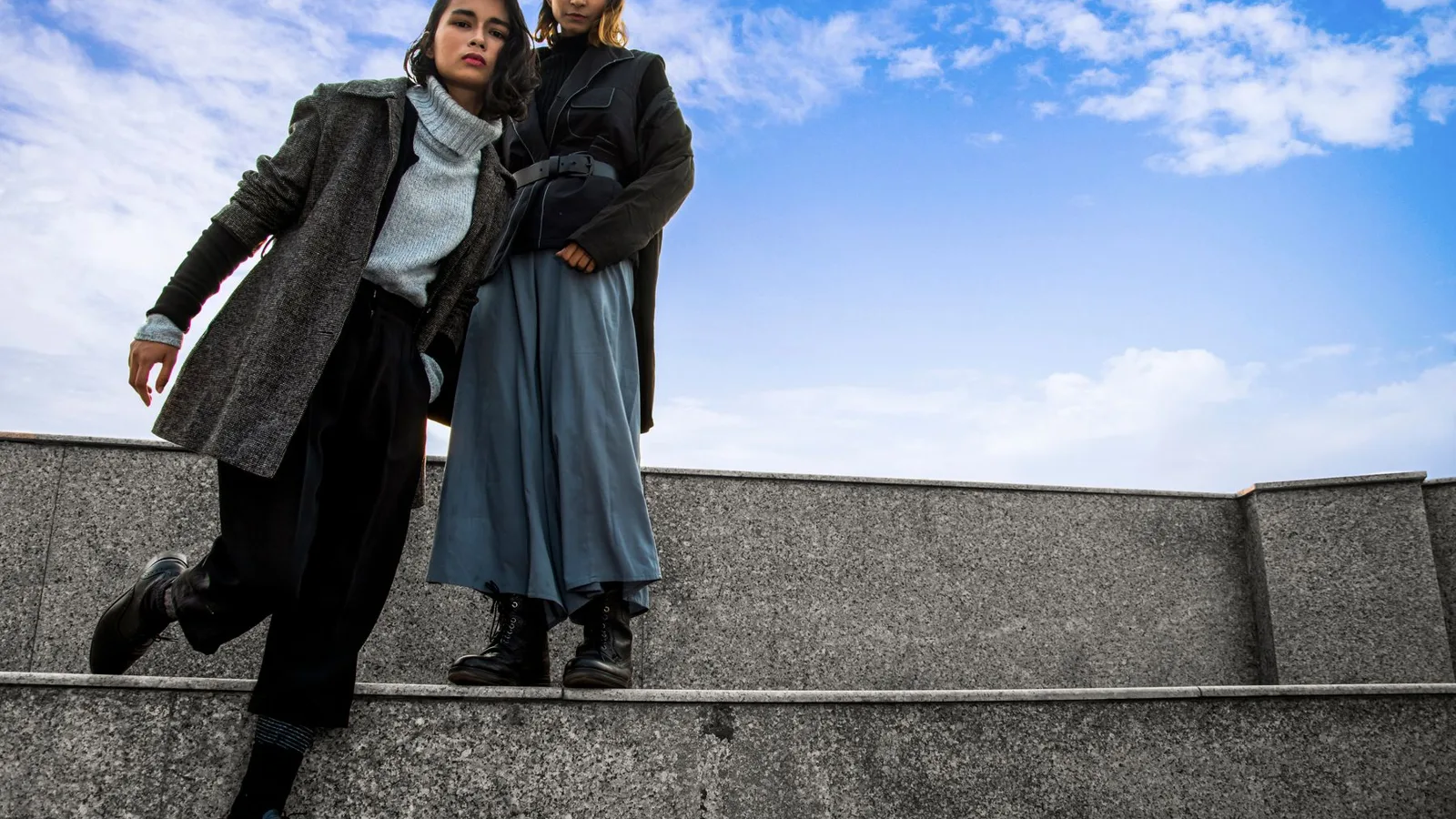 Two women in stylish attire posing outdoors in Patna, India.